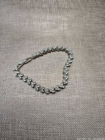 Full view of bracelet laid flat forming heart shape