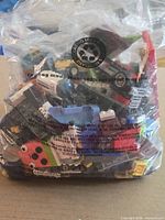 Front view of clear bag showing assorted LEGO pieces