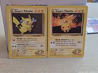 Both Lt. Surge’s Pikachu cards side by side