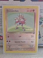 Front of Hitmonchan Best of Game winner reverse holo card in sleeve