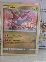 Front of Latias SM135 promo card in sleeve