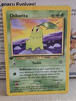 Front of Chikorita 1st Edition card showing artwork, set info and condition wear