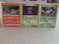 Group shot of Sizzlipede, Oddish and Cherubi cards side by side