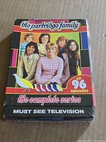 Front of sealed Partridge Family Complete Series DVD box showing cast photo and 96 episodes note