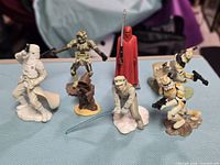 All seven Star Wars figurines grouped