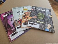 Four Toronto Life magazines fanned out