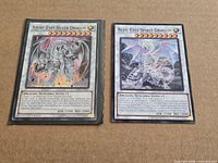 Both Yu-Gi-Oh! Synchro Dragon cards side by side