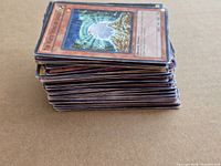 Side view of stacked Yu-Gi-Oh cards