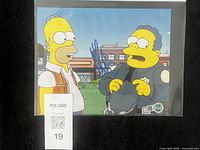 Full photo in sleeve with COA sticker and lot tag visible