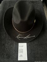 Top view of autographed black felt cowboy hat