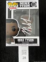Front view of boxed Funko Pop showing Mike Tyson figure and autograph