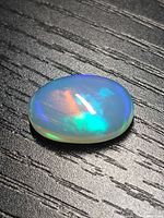 Front view of opal cabochon showing play-of-colour