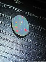 Top view of oval opal showing full play of color