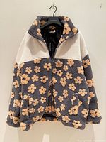 Front view of the fleece jacket on hanger