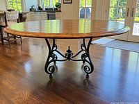 Full view of round table on wood floor