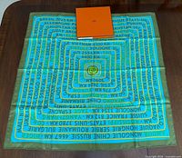 Full view of unfolded scarf with box centred