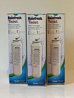 Front view of three boxed Rainfresh Twist model QLV cartridges