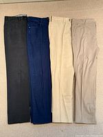 Four pairs of pants laid flat showing colours and length