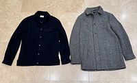 Both garments laid flat: grey Gabba coat, navy Brax jacket