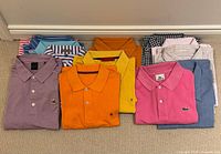 Group of folded shirts showing colours and patterns