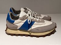 side view of both sneakers showing colorway and condition