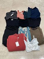 Ten size-M garments laid out for overview