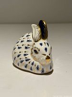 Front-left view of Royal Crown Derby Imari rabbit figurine showing face, ear, and pattern details