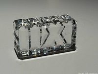 Front angled view of clear crystal XII paperweight