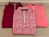 Front view of all three shirts folded