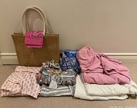 All items grouped: tote, bandana and folded garments