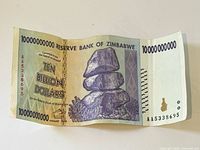 Front of 10 billion dollar Zimbabwe note showing denomination, Reserve Bank text, stacked stones, full note