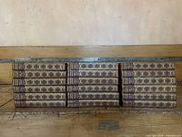 All eighteen volumes aligned spine out
