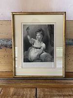 Full view of framed etching showing image, mat, and frame
