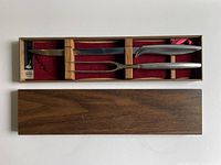 Knife and fork seated in red-felt walnut box, Gerber tag visible