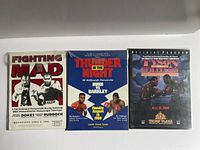 Front covers of the three boxing programs