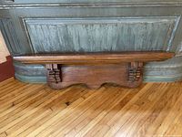 Front angled view showing shelf, corbels and shaped back