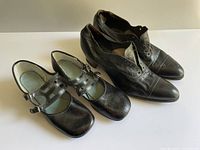 Both pairs of shoes side by side showing overall condition and size comparison
