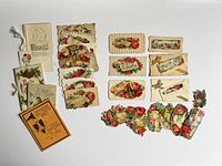 Overall lot showing cards, booklet, scrap garland
