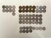 All 58 nickels arranged by type and date groupings