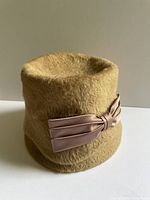 full view side of beige mohair hat with ribbon bow