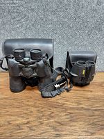 Both binoculars with their cases displayed
