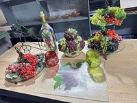 Group shot of all eight grape-themed décor pieces on tabletop