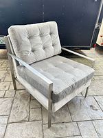 Front angle view showing overall chair design, cushions, frame