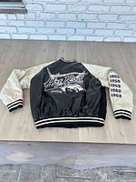 Full jacket back view showing body, sleeves, rib knit trim