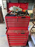 Full view of two-piece Husky red rolling tool chest on casters