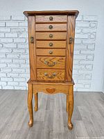 Front view of oak jewellery chest, closed