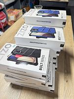 Stack of multiple Zizo Bolt Series case boxes showing quantity