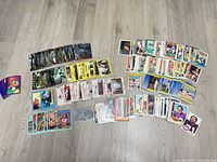 Overview of all trading card stacks spread on floor