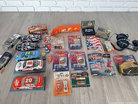 Group shot of all NASCAR diecast cars, collectibles, headphones and accessories