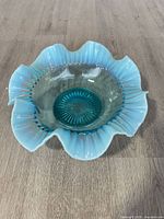 Top view showing ruffled rim and opalescent fade